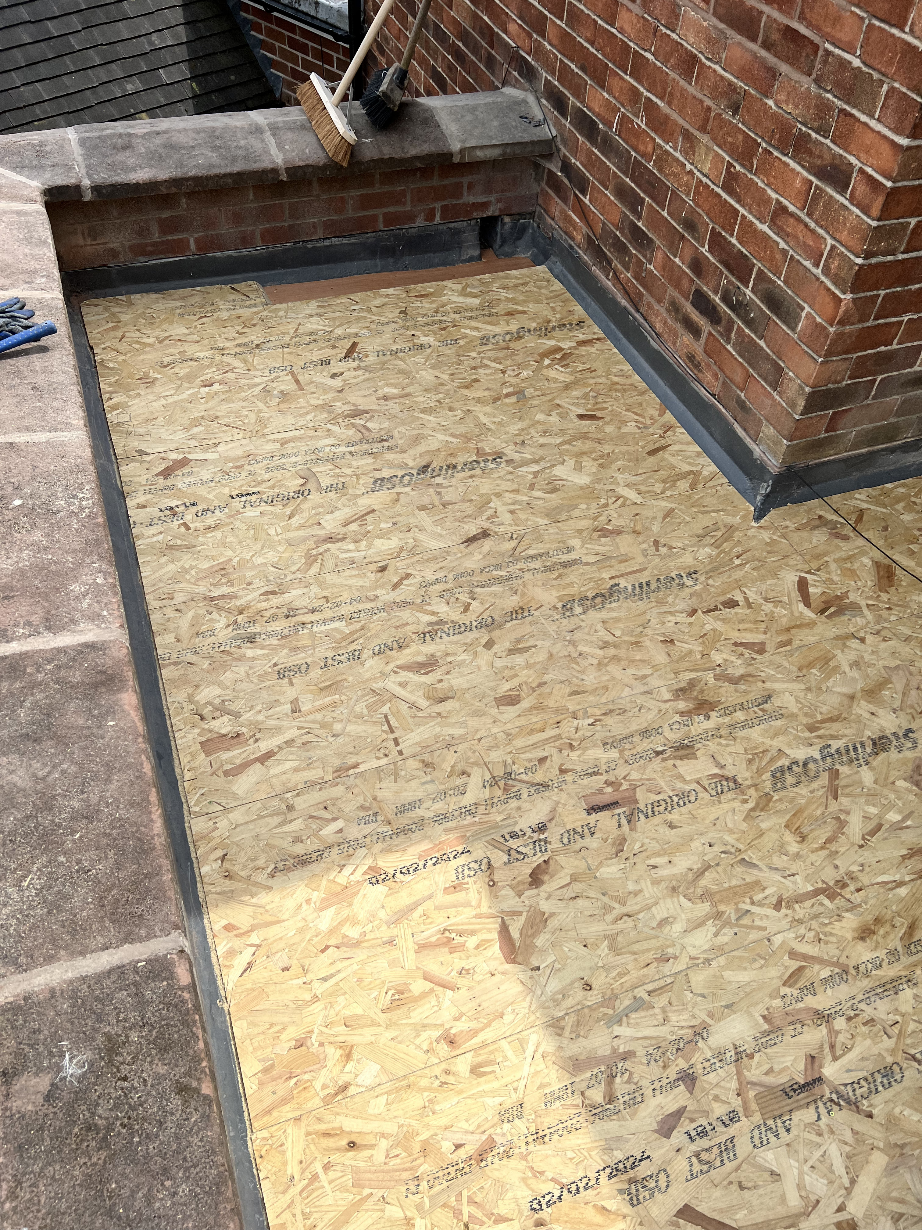 Flat warm deck roof construction in progress