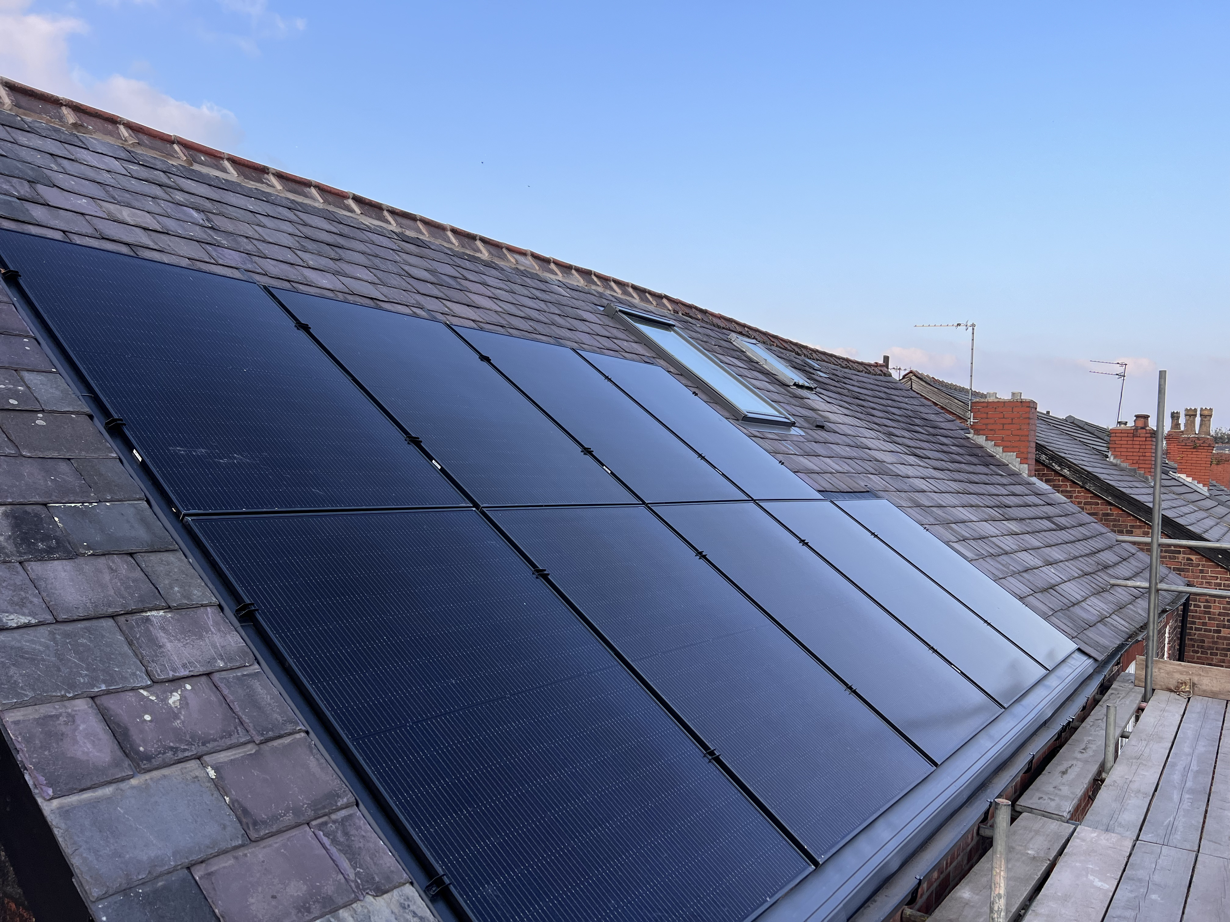 Solar PV panels mounted on a pitched tiled roof